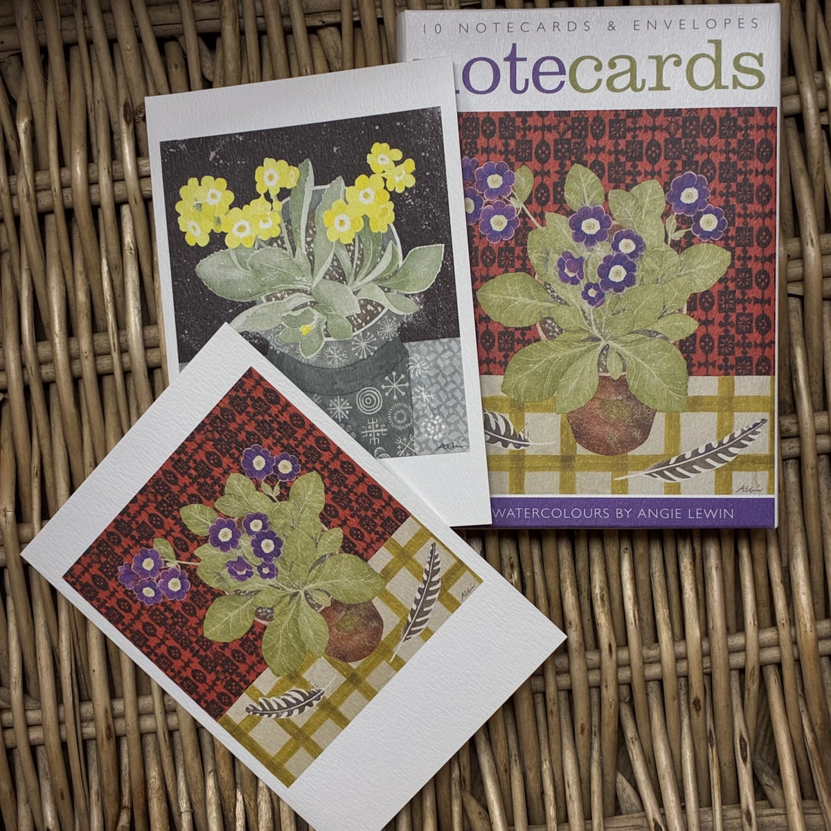Auriculas and Primroses by Angie Lewin. Packs contains 10 cards and envelopes, 5 each of 2 designs - 105mm x 148mm. Printed in the UK by Art Angels Publishing.