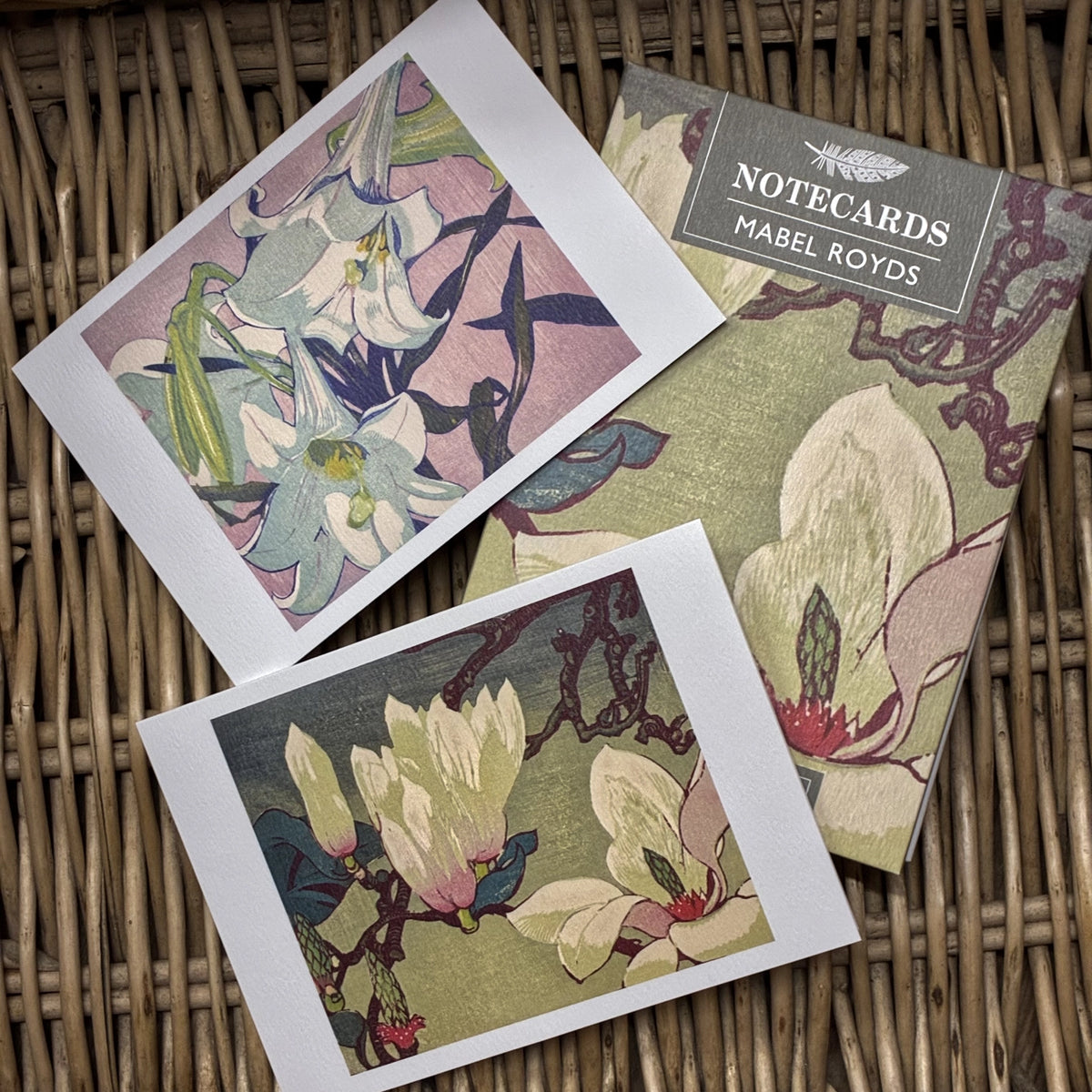 Magnolias & White Lilies by Mabel Royds. Packs contains 10 cards and envelopes, 5 each of 2 designs - 105mm x 148mm. Printed in the UK by Art Angels Publishing.